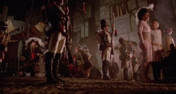 Movie still from “Time Bandits” (1981), directed by Terry Gilliam – A group of people dressed in medieval costumes; Wide shot, Low angle