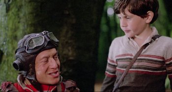 Movie still from “Time Bandits” (1981), directed by Terry Gilliam – A man and a boy are talking to each other; Medium shot, Over the shoulder angle
