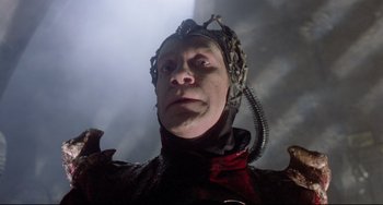 Movie still from “Time Bandits” (1981), directed by Terry Gilliam – A person wearing a helmet; Close Up shot, Low angle