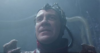 Movie still from “Time Bandits” (1981), directed by Terry Gilliam – A person wearing a diving suit; Close Up shot, Low angle