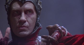 Movie still from “Time Bandits” (1981), directed by Terry Gilliam – A person wearing a costume; Close Up shot, Low angle