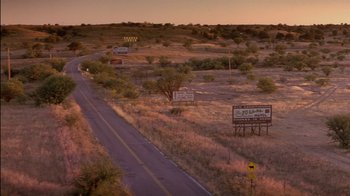 Movie still from “Tin Cup” (1996), directed by Ron Shelton – An image of a road that is in the middle of nowhere; Extreme Wide shot, High angle