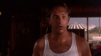 Movie still from “Tin Cup” (1996), directed by Ron Shelton – A person wearing a tank top; Close Up shot, Low angle
