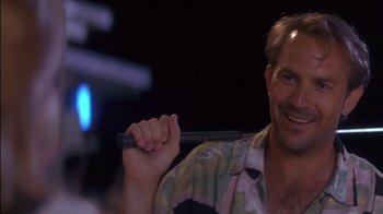 Movie still from “Tin Cup” (1996), directed by Ron Shelton – A person holding a pencil; Close Up shot, Low angle