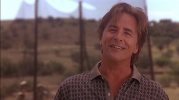 Movie still from “Tin Cup” (1996), directed by Ron Shelton – A person wearing a button up shirt; Close Up shot, Low angle