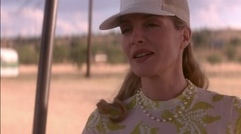 Movie still from “Tin Cup” (1996), directed by Ron Shelton – A person wearing a hat; Close Up shot, Low angle