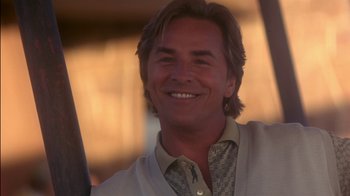Movie still from “Tin Cup” (1996), directed by Ron Shelton – A person with a baseball bat; Close Up shot, Low angle