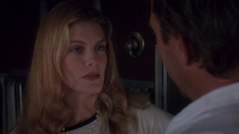 Movie still from “Tin Cup” (1996), directed by Ron Shelton – A man and a woman are looking at one another; Close Up shot, Over the shoulder angle