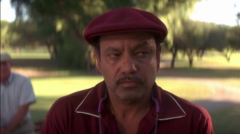 Movie still from “Tin Cup” (1996), directed by Ron Shelton – A person wearing a hat; Close Up shot, Low angle