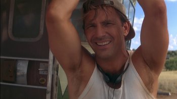 Movie still from “Tin Cup” (1996), directed by Ron Shelton – A person wearing a hat; Close Up shot, Low angle