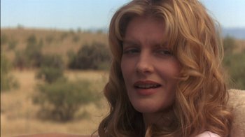 Movie still from “Tin Cup” (1996), directed by Ron Shelton – A person with long blonde hair; Close Up shot, Low angle