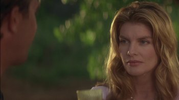 Movie still from “Tin Cup” (1996), directed by Ron Shelton – A person with long red hair; Close Up shot, Over the shoulder angle
