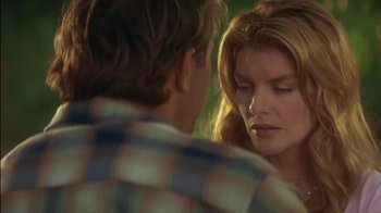Movie still from “Tin Cup” (1996), directed by Ron Shelton – A man and a woman looking at one another; Close Up shot, Over the shoulder angle