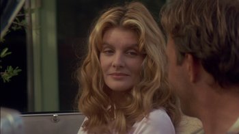 Movie still from “Tin Cup” (1996), directed by Ron Shelton – A person with long blonde hair; Close Up shot, Over the shoulder angle