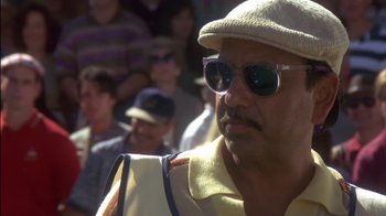 Movie still from “Tin Cup” (1996), directed by Ron Shelton – A person wearing sunglasses and a hat; Close Up shot, Low angle