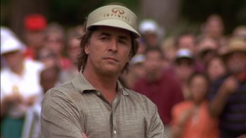Movie still from “Tin Cup” (1996), directed by Ron Shelton – A person wearing a hat; Close Up shot, Low angle