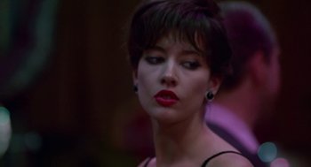 Movie still from “Tin Men” (1987), directed by Barry Levinson – A person with short hair wearing a dress; Close Up shot, Low angle