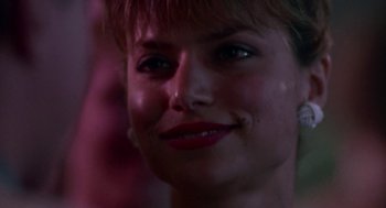 Movie still from “Tin Men” (1987), directed by Barry Levinson – A woman's face in the dark; Close Up shot, Over the shoulder angle