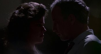 Movie still from “Tin Men” (1987), directed by Barry Levinson – A man and a woman face to face in the dark; Close Up shot, Low angle