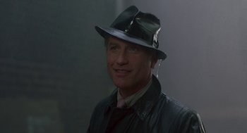 Movie still from “Tin Men” (1987), directed by Barry Levinson – A man wearing a hat and a leather jacket; Close Up shot, Low angle