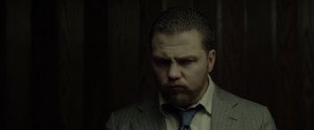 A person wearing a suit and tie