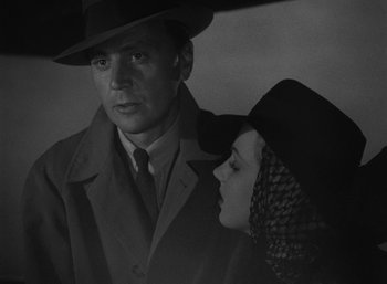 Movie still from “To Have and Have Not” (1944), directed by Howard Hawks – A man and a woman standing next to each other; Close Up shot, Low angle