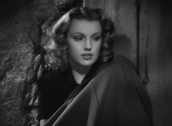 Movie still from “To Have and Have Not” (1944), directed by Howard Hawks – A black and white photo of a woman with long blonde hair; Close Up shot, High angle