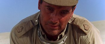 Movie still from “Tobruk” (1967), directed by Arthur Hiller – A person wearing a hat; Close Up shot, Low angle