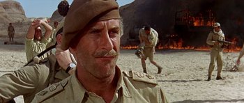 Movie still from “Tobruk” (1967), directed by Arthur Hiller – An older man wearing a military uniform and a hat; Close Up shot, Low angle