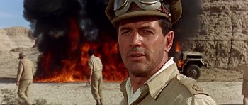 Movie still from “Tobruk” (1967), directed by Arthur Hiller – A person wearing a uniform; Close Up shot, Low angle