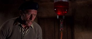 Movie still from “Tobruk” (1967), directed by Arthur Hiller – An old man with a mustache wearing a hat; Close Up shot, Low angle