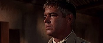 Movie still from “Tobruk” (1967), directed by Arthur Hiller – A person wearing a jacket; Close Up shot, Low angle