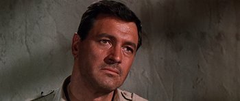 Movie still from “Tobruk” (1967), directed by Arthur Hiller – A person wearing a uniform; Close Up shot, Low angle