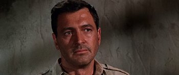 Movie still from “Tobruk” (1967), directed by Arthur Hiller – A person wearing a brown shirt; Close Up shot, Low angle