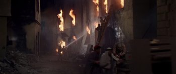 Movie still from “Tobruk” (1967), directed by Arthur Hiller – A group of people that are standing in the fire; Wide shot, High angle