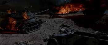 Movie still from “Tobruk” (1967), directed by Arthur Hiller – An image of a tank in the middle of the desert; Extreme Wide shot, High angle