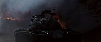 Movie still from “Tobruk” (1967), directed by Arthur Hiller – A tank with a gun on top of it in the dark; Medium shot, Low angle