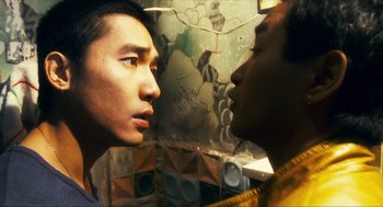 Movie still from “Happy Together” (1997), directed by Kar-Wai Wong – Two young men looking into each other's eyes; Close Up shot, Over the shoulder angle