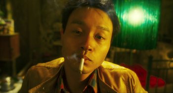 Movie still from “Happy Together” (1997), directed by Kar-Wai Wong – A man with a cigarette in his mouth; Close Up shot, Low angle