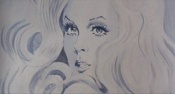 Movie still from “Tommy” (1975), directed by Ken Russell – A painting of a woman's face with long hair and blue eyes; Extreme Close Up shot, Overhead angle