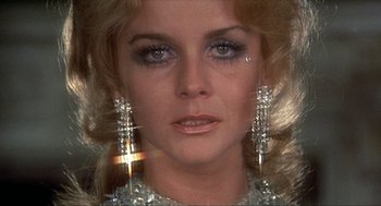 Movie still from “Tommy” (1975), directed by Ken Russell – A person wearing earrings; Close Up shot, Low angle
