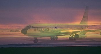 Movie still from “Topaz” (1969), directed by Alfred Hitchcock – A us air force jet plane on the runway at sunset; Wide shot, Low angle