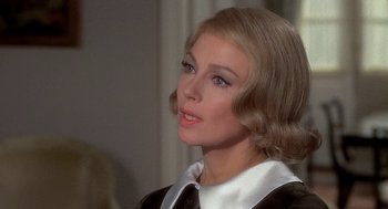 Movie still from “Topaz” (1969), directed by Alfred Hitchcock – A person wearing a suit and tie; Close Up shot, Over the shoulder angle