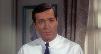 Movie still from “Topaz” (1969), directed by Alfred Hitchcock – A person wearing a shirt and a tie; Close Up shot, High angle