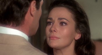 Movie still from “Topaz” (1969), directed by Alfred Hitchcock – A woman's face as a man looks on; Close Up shot, Over the shoulder angle