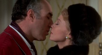 Movie still from “Topaz” (1969), directed by Alfred Hitchcock – A man and a woman are kissing in a room; Close Up shot, Over the shoulder angle