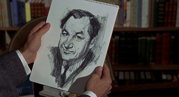 Movie still from “Topaz” (1969), directed by Alfred Hitchcock – A person holding a drawing of a man in a business suit; Close Up shot, High angle