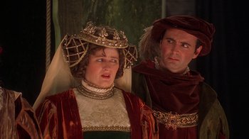 Movie still from “Topsy-Turvy” (1999), directed by Mike Leigh – A man and a woman dressed in renaissance costumes; Close Up shot, Over the shoulder angle