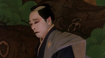 Movie still from “Topsy-Turvy” (1999), directed by Mike Leigh – A person with a geisha make - up on; Close Up shot, Low angle