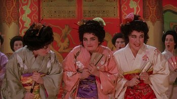 Movie still from “Topsy-Turvy” (1999), directed by Mike Leigh – A group of women dressed in geisha outfits; Close Up shot, High angle